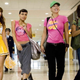 the four actors walking in an airport.